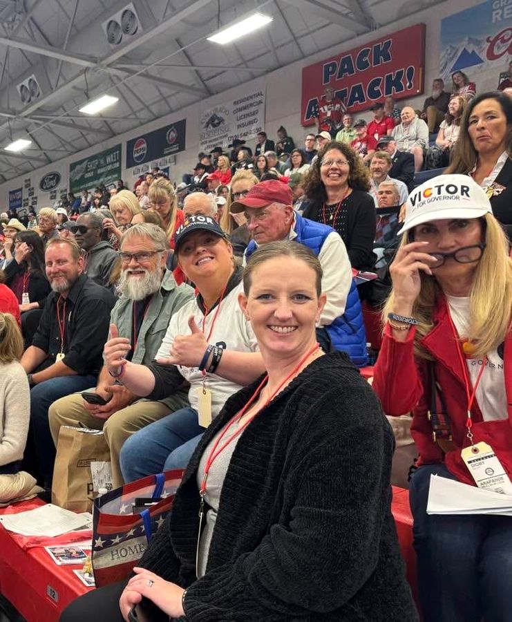 Rebecca Winegar with delegates at the Colorado State Assembly, April 2026