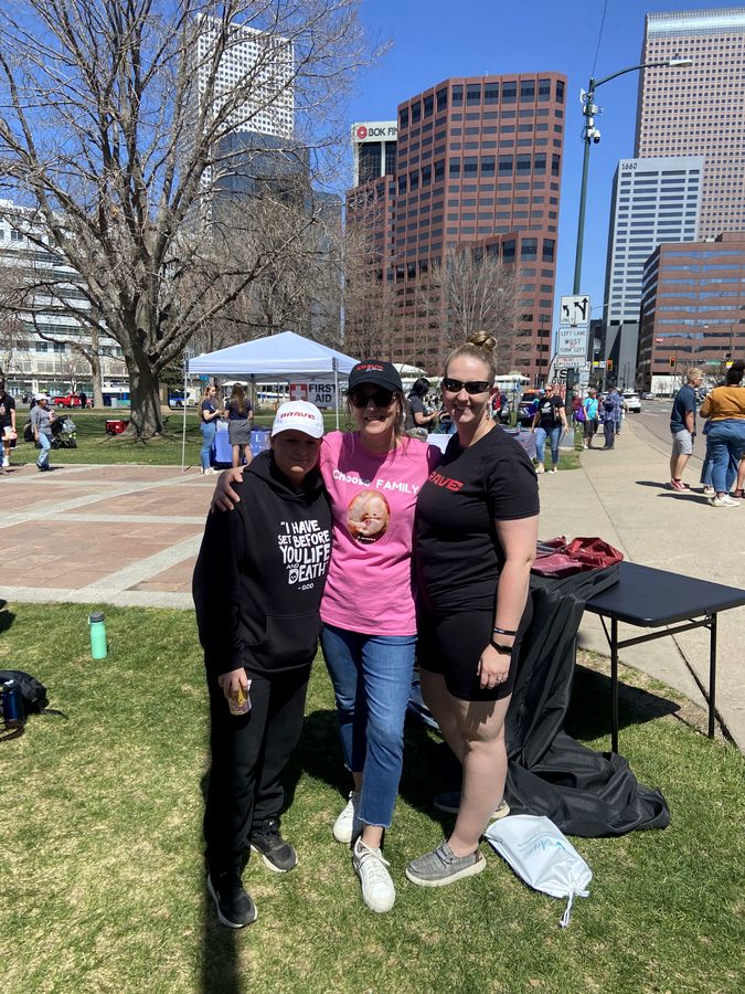Rebecca Winegar with women on International Women's Day, downtown Denver, March 2025